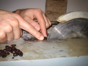 making a cut on a coffee seed